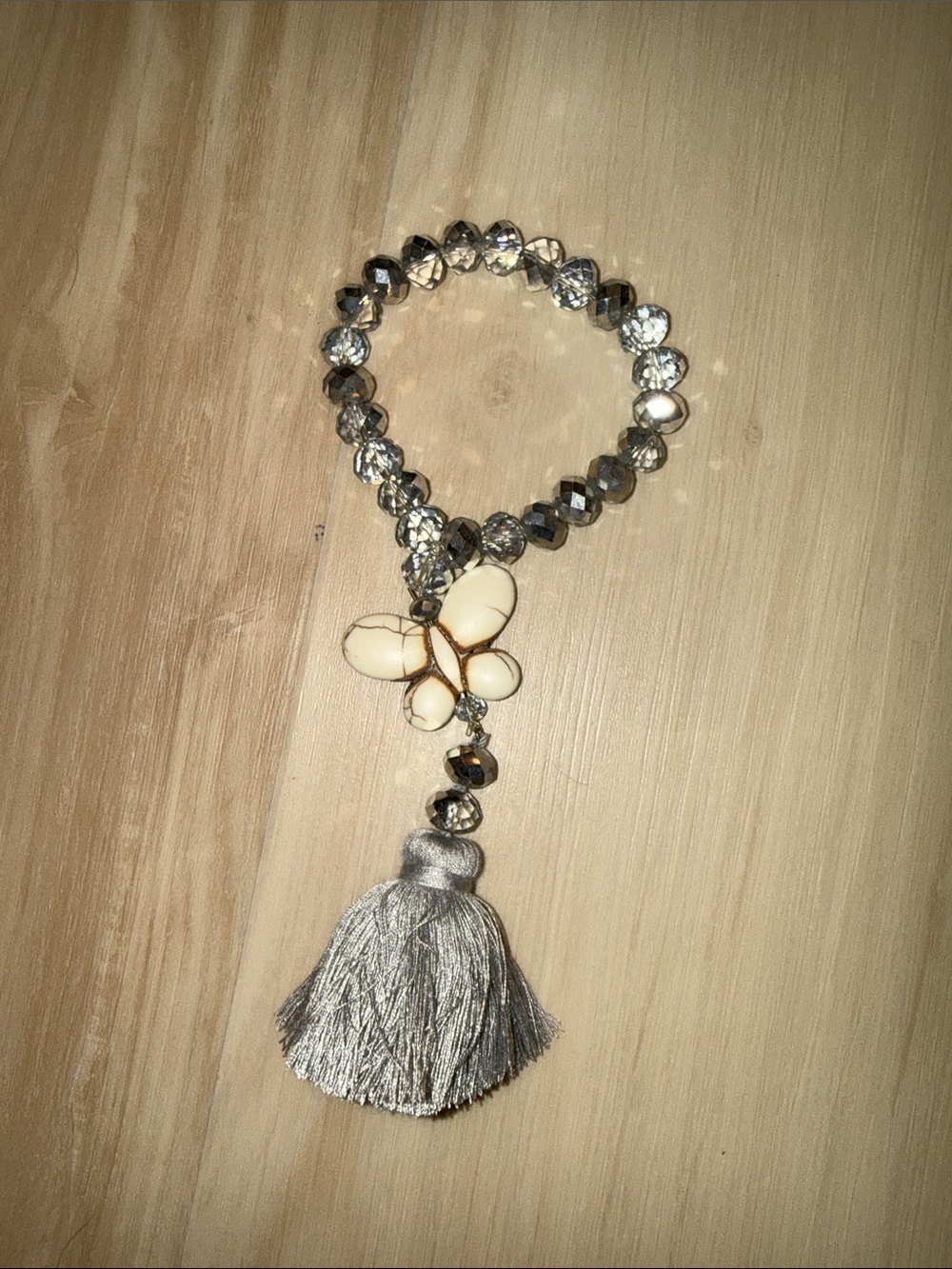 Crystal Bead Bracelet with Ivory Butterfly and Silver Tassel Charm